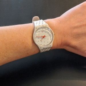 White tennis Swatch watch.